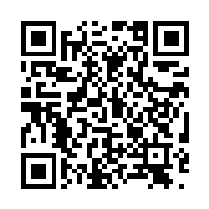 一辆出租车在一栋白色的建筑物前停下二维码生成