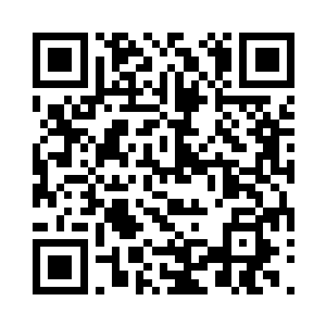 一边朝觉哥口袋里塞了一把深红色的晶石二维码生成