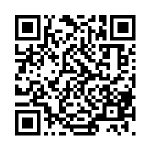 位于大殿正中莲台之上的如来金身微微低头二维码生成