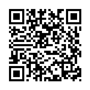 刘玉成把手搁在蜂窝煤炉子上试验了一下热度二维码生成