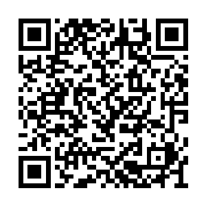 只有他头上的夜视仪显示着与普通也门人的不同二维码生成