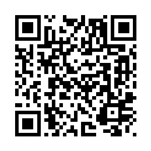 坐在椭圆办公桌后的罗宾・格兰德二维码生成