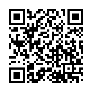 大家都瞪大眼睛看着尹大发坐在主席台上讲话二维码生成