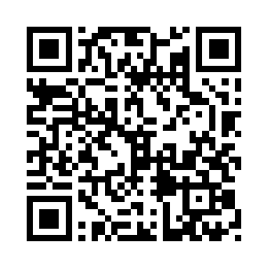 就见猴子正坐在办公桌后面打电话二维码生成