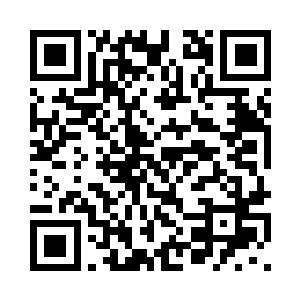 戚国丰身后的老者听到戚国丰的话二维码生成