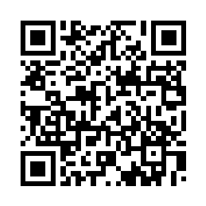 放着一只咖啡杯和一个笔记本电脑二维码生成