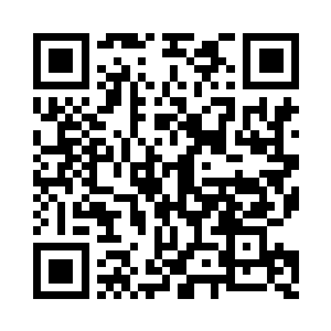 有些一瘸一拐地走向一旁被关押的人质房间二维码生成