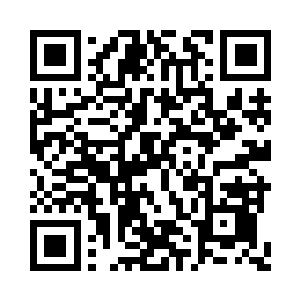 王雅君从客厅的柜子里面拿出了一台数码相机二维码生成