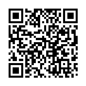 目光无意中看到了不远处屋顶上的广君安二维码生成