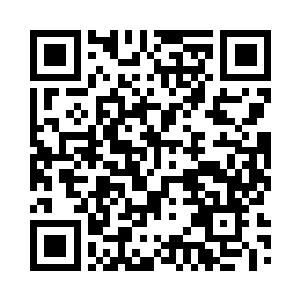 站在远处沙丘上的狼王仰头嚎叫一声二维码生成