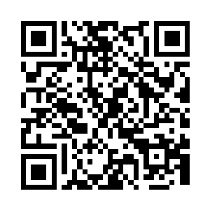 那名刀疤男被两名警察带进了审讯室中二维码生成