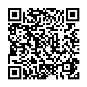 院中有一座明显比村中所有房屋都要大出许多的石屋二维码生成